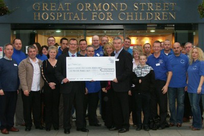 28 Franchisees along with Cath & Mark Higham present a cheque for 1 million 